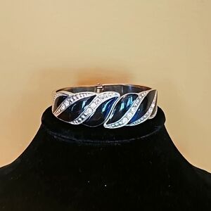 Black and silvertone bangle bracelet with rhinestones